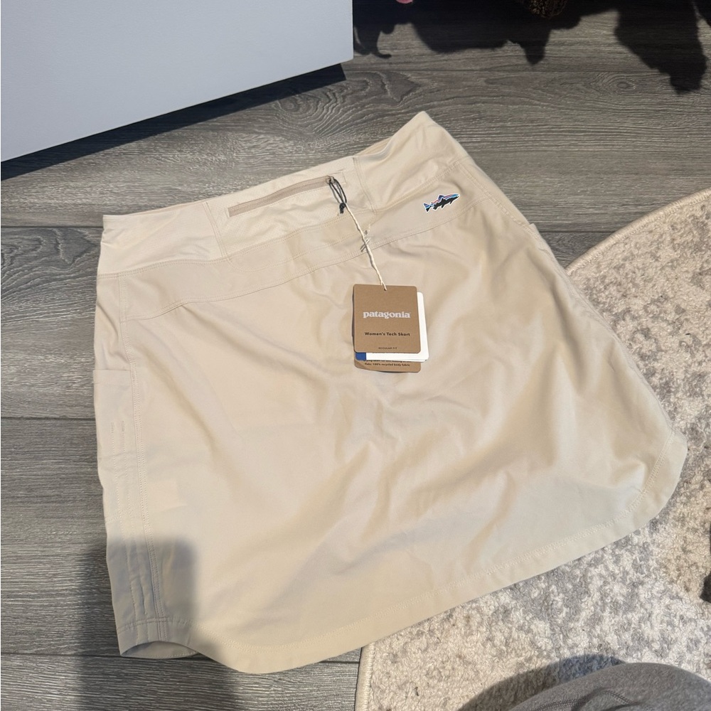 Patagonia tech skort (shirt with shorts underneath). NWT. Tan color. Size small